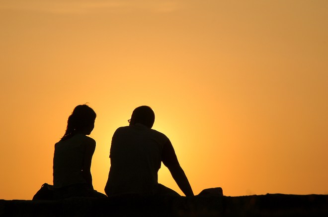 bigstock_Silhouetted_loving_couple_at_s_25932527